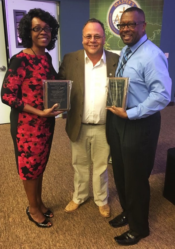 The Hoytes are pictured with President of Masters International University Dr Denis Frey following their graduation ceremony on February 11, 2017. (Photo Credit: First Assembly of God) 