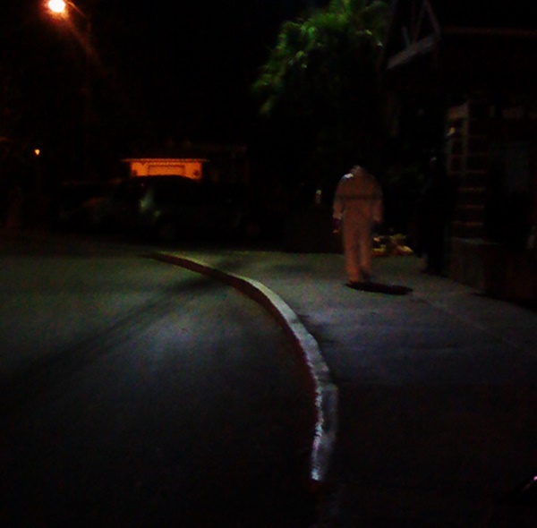 One of the crime scene detectives searching for evidence 