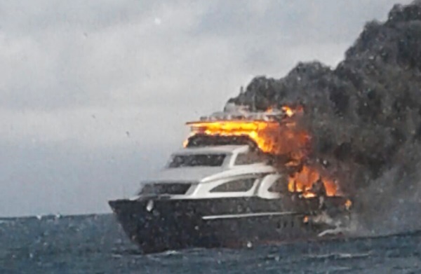 Persons escape burning yacht
