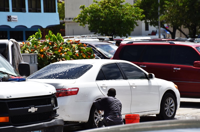 City hunts solution; car washers hunt earnings