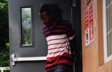 Nickail Chambers being escorted from the Magistrate's Court