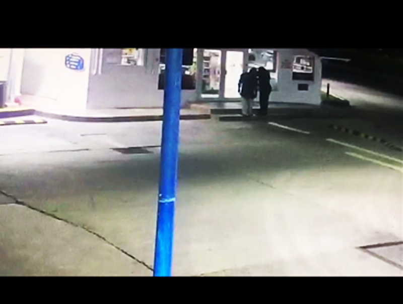 2 gunmen struggle to shoot down gas station door