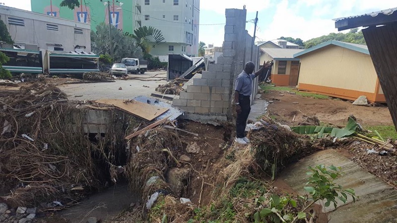 Flood water knocks out wall -School badly affected