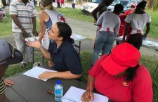 Members of the BVI Red Cross while registering families for the Household Assistance Programme recently. Facebook photo