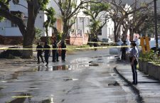 Police at the scene of a murder this year.