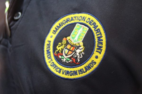 Immigration officer charged for stealing