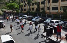 Protesters marching against government.