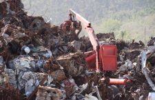 Heavy equipment being used to clear debris at the dump.