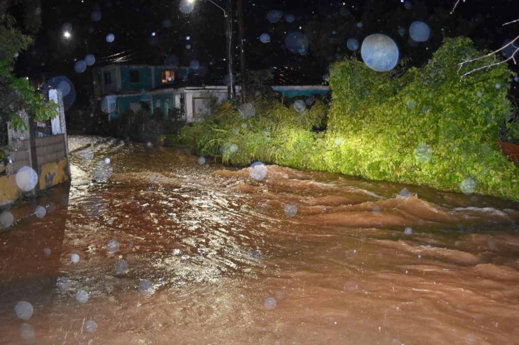 Considerable flood waters wash through some BVI communities