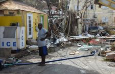 This resident is photographed on Main Street, Tortola standing around debris deposited by Hurricane Irma back in 2017. (BVI News photo)