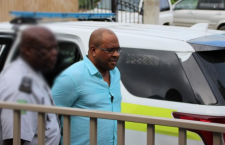 Kirk Hughes being escorted from court on a previous occasion.