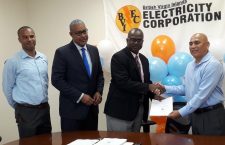 From left: BVIEC's Deputy General Manger Henry Creque is photographed whith General Manager Leroy Abraham and BVIEC   Chairman Ron Potter who shakes hands with  Rufino Lin of  BVIEC'
SOL Ltd.