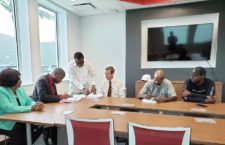 Dr Wheatley at a contract signing for restoration works to the Virgin Gorda Sports COmplex.