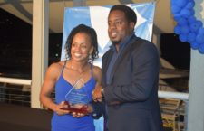 President of the BVI Athletics Association Steve Augustine presents veteran athlete Tahesia Harrigan-Scott with the 2019 BVI Athletics Lifetime Achievement Award.