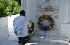Premier Andrew Fahie lays a wreath at the late H Lavity Stoutt's burial site.