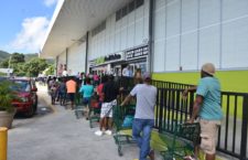 Scores of shoppers queued outside RiteWay Food Market in Pasea Estate on Thursday, March 26. (Photo by Kamal Haynes/BVI News Staff)