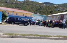 In this BVI News photo captured on April 2, Thursday shoppers are spotted in a queue at OneMart Superstore that extends to the main road of Purcell Estate on Tortola. Similar images were seen across all other local supermarkets.