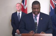 Premier Fahie (foreground) and Governor Jaspert during an April 15 public broadcast.