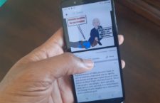 VINO's cartoon displayed on a cell phone screen.