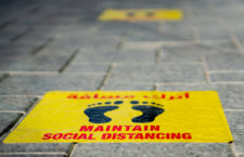Maintain Social distancing stickers pasted on the floor in front of the restaurant in Qatar Qatar