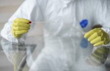 Doctor taking a swab sample.