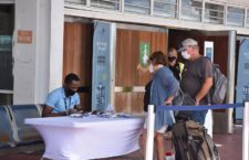 Travellers being accessorised with a GPS bracelet upon arrival at the TB Lettsome International Airport on Beef Island. (Photo by Kamal Haynes)