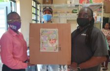 CTL's David Thomas handing over boxes to the FSN. (Contributed photo)