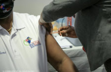 Health Minister Carvin Malone receiving his vaccination