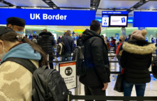 Stock image of air travellers queued at border control at Heathrow Airport in the UK.