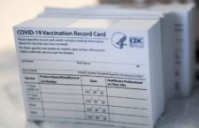 A stack of COVID-19 Vaccination Record Cards from the CDC. (Photo credit: MediaNews Group via Getty Images)