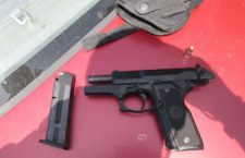 Two charged after police uncover ‘hidden’ gun, bullets in vehicle