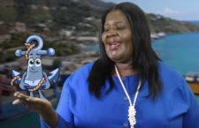 Managing Director of the Ports Authority, Oleanvine Maynard with mascot for the the Authority's Pilot Port Education Programme, Andy the Anchor.