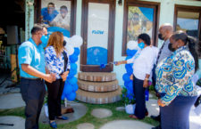 Flow Senior Retail Sales Associate, Alicia Stevens Modeste is pictured as she cut the ribbon for the opening of the new Flow Retail Store in Virgin Gorda on April 25, 2022 as Territorial At-Large Representative and Junior Minister for Trade and Economic Development, Honourable Shereen Flax-Charles, and members of the Virgin Gorda Community and Flow BVI Team Members look on. (Photo Credit: Dame Peters/TFM)