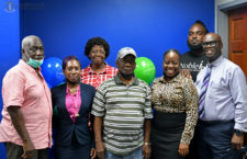 Photo of winners, as well as judge representative Mr. Jordan Lewis and CEO of
Commission, Mr Guy Malone. ((Photo Credit: Franklin Skerritt/GIS)