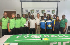 Staff and players of BVI under-17 football team along with coach and members of U-14 team.